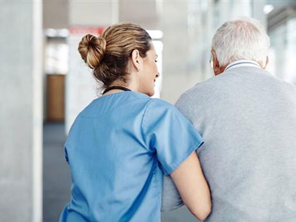 Dr helping elderman man walk