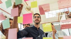 a group of businesspeople brainstorming with notes on glass wall in an office