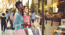 Female friends window shopping in the summer