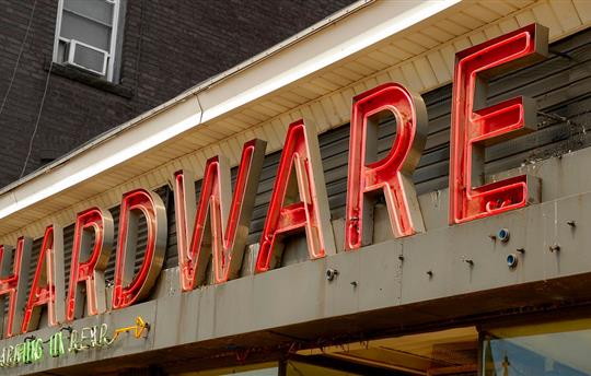 neon hardware store sign
