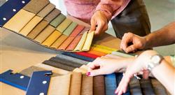 three sets of hands going through upholstery swatches