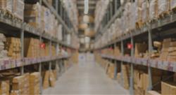 warehouse aisle filled with boxes and pallets